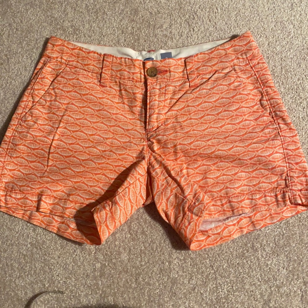 Cute shorts with coral color fish print .